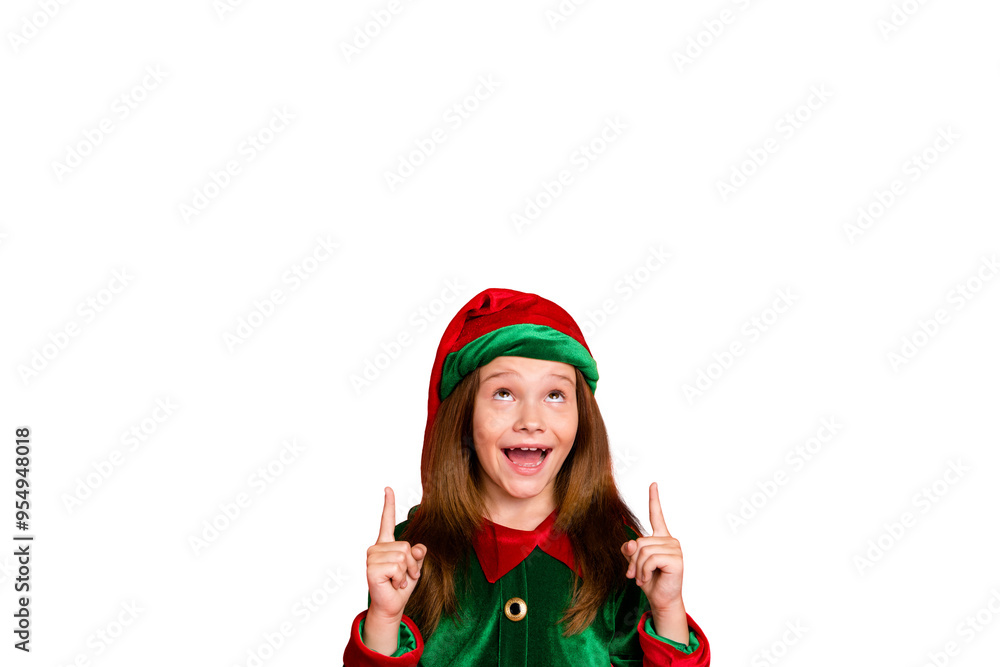 Portrait of impressed elf child in hat cap screaming wow omg showing adverts with her index finger isolated over red background Portrait of impressed elf child in hat cap screaming wow omg showing adverts with her index finger isolated over red background