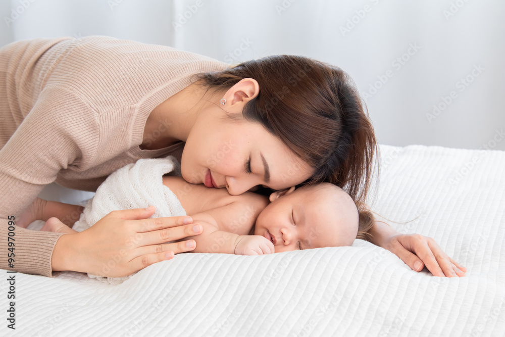 Asian beautiful mother motherhood lie down nursing, kissing newborn baby, gently hold infant together, love bonding at first site, toddler sleep leisure comfortable, healthcare and medical taking care Asian beautiful mother motherhood lie down nursing, kissing newborn baby, gently hold infant together, love bonding at first site, toddler sleep leisure comfortable, healthcare and medical taking care