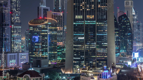 Canvas Print Aerial view on downtown and financial district in Dubai night timelapse, United Arab Emirates with skyscrapers and highways