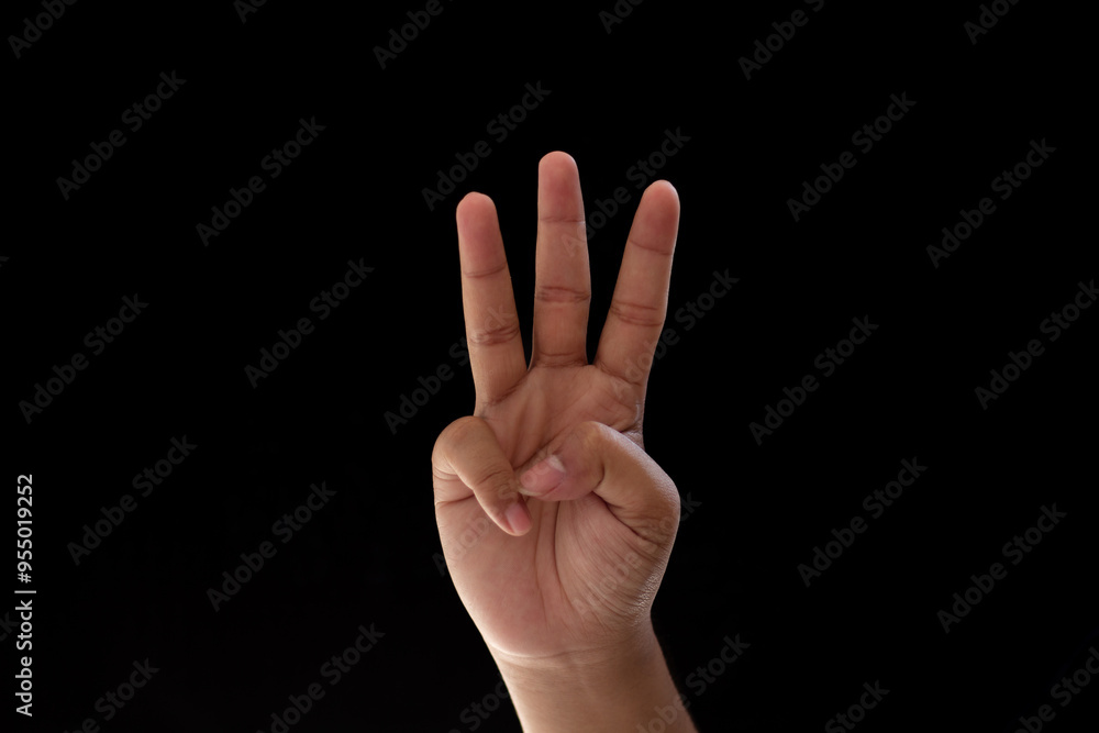 Close-up of one hand showing the number three. Photo isolated on black background Close-up of one hand showing the number three. Photo isolated on black background