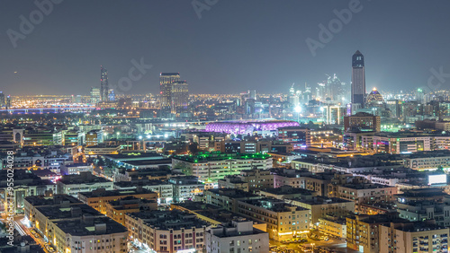 Aerial view of neighborhood Deira with typical buildings night timelapse, Dubai, United Arab Emirates