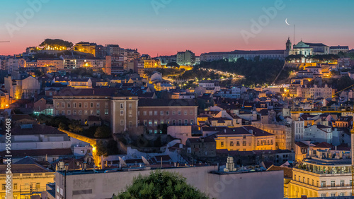 Lisbon aerial cityscape skyline night to day timelapse from viewpoint of St. Peter of Alcantara, Portugal