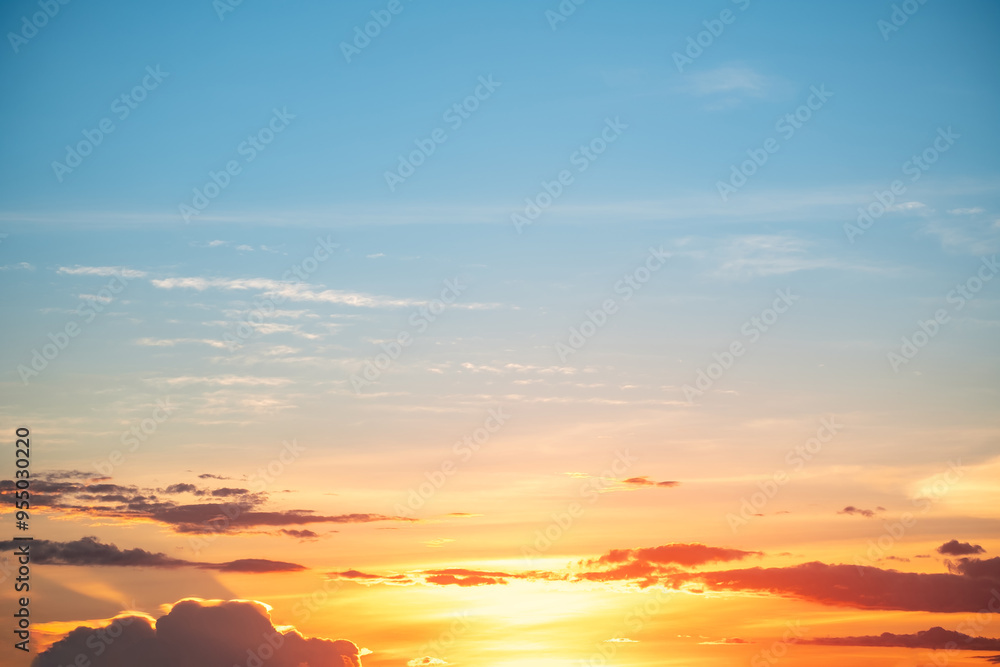 Obraz premium Beautiful , luxury soft gradient orange gold clouds and sunlight on the blue sky perfect for the background, take in everning,Twilight, Large size, high definition landscape photo