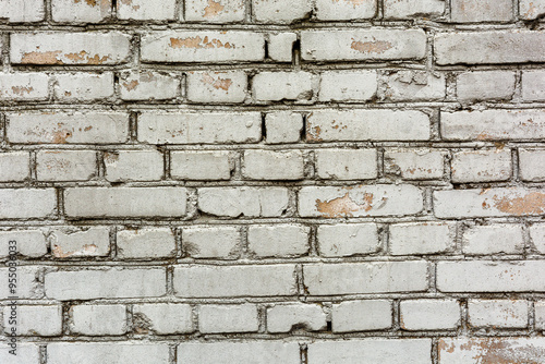Wall of old white brick with cement mortar