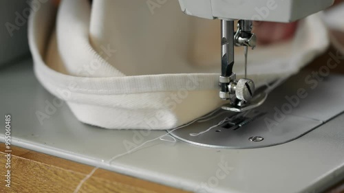 Wallpaper Mural Close-up of women's hands sewing fabric on a sewing machine Torontodigital.ca