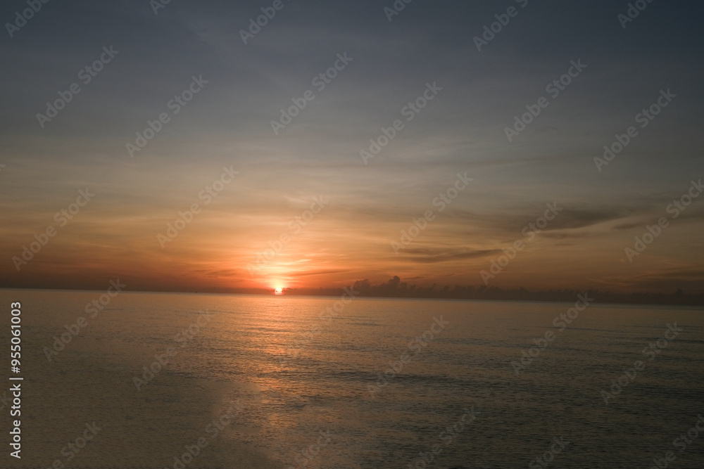 The sun rises at the sea in the morning. The sun rises at the sea in the morning.