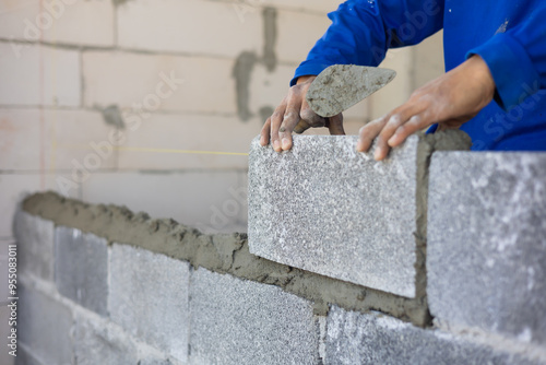 Fotografi Close up hand construction mason worker bricklayer Engineering people, man construction worker and architecture bricklayers working in work at house construction site