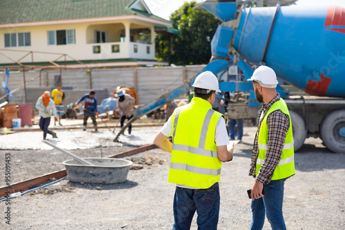 wet concret. Engineering people, construction site. construction worker and architecture pouring wet concret in road construction site. Caucasian men