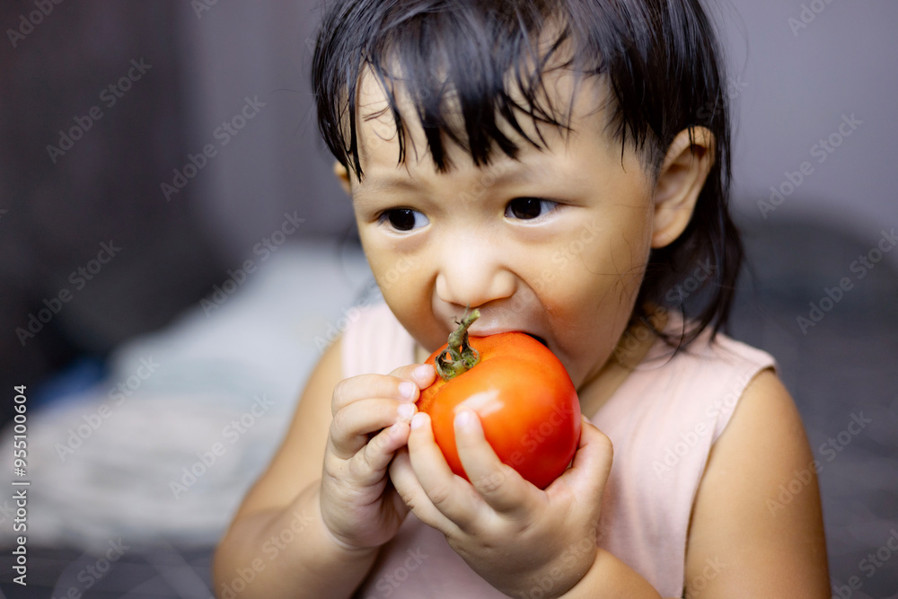 Child Biting Tomato