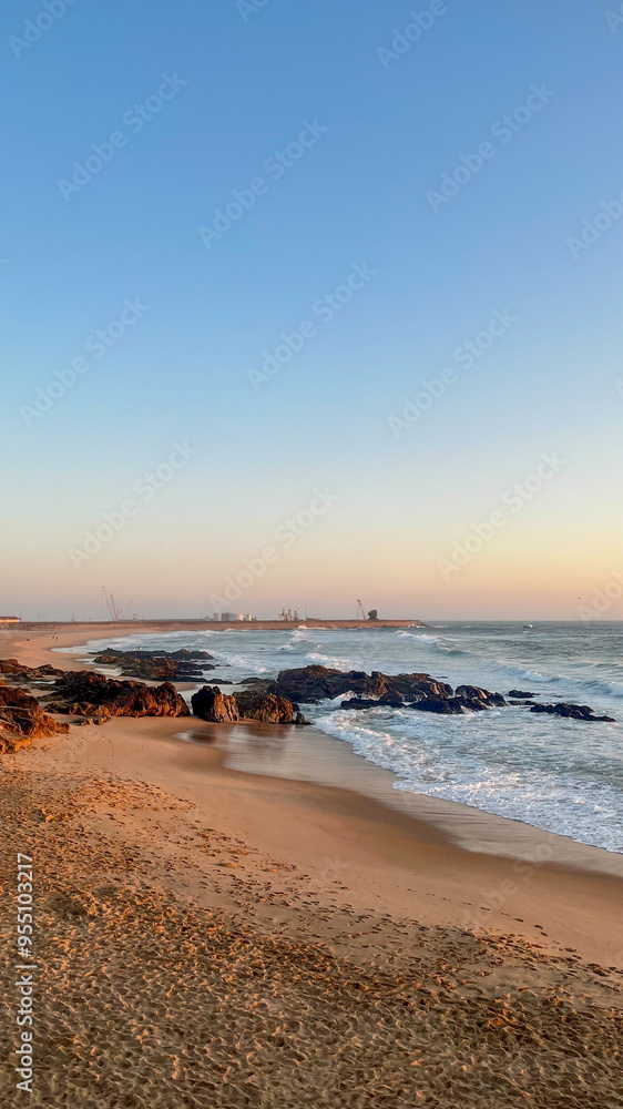 Beautiful sunset in Porto casting a warm glow over the beach - Portugal Beautiful sunset in Porto casting a warm glow over the beach - Portugal