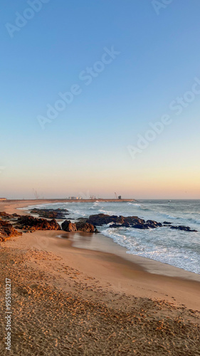 Beautiful sunset in Porto casting a warm glow over the beach - Portugal