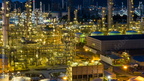 Oil Refinery plant at sunset. Gas Chemical Equipment Prodiction import export Concept, Crude Oil Refinery Plant Steel Pump Pipe line and Chimney and Cooling tower, Chemical Petrochemical photo