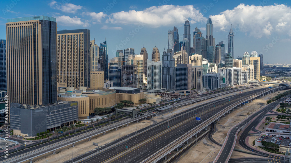 Dubai Marina skyscrapers aerial top view with clouds from JLT in Dubai timelapse, UAE. Dubai Marina skyscrapers aerial top view with clouds from JLT in Dubai timelapse, UAE.