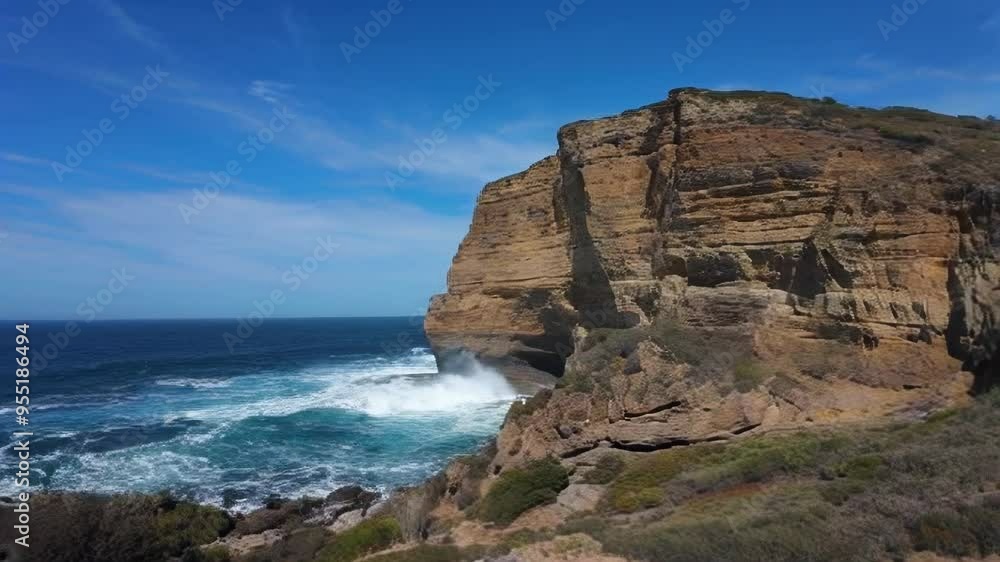 A serene coastal scene showcasing cliffs, crashing waves, and vibrant blue skies, highlighting the beauty of nature. A serene coastal scene showcasing cliffs, crashing waves, and vibrant blue skies, highlighting the beauty of nature.
