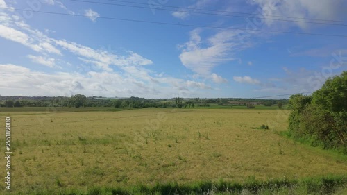 Riding Past Sunny Field in France photo