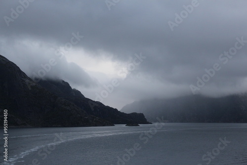 Canvas Print Grey clouds and fog over mountains in the North Sea