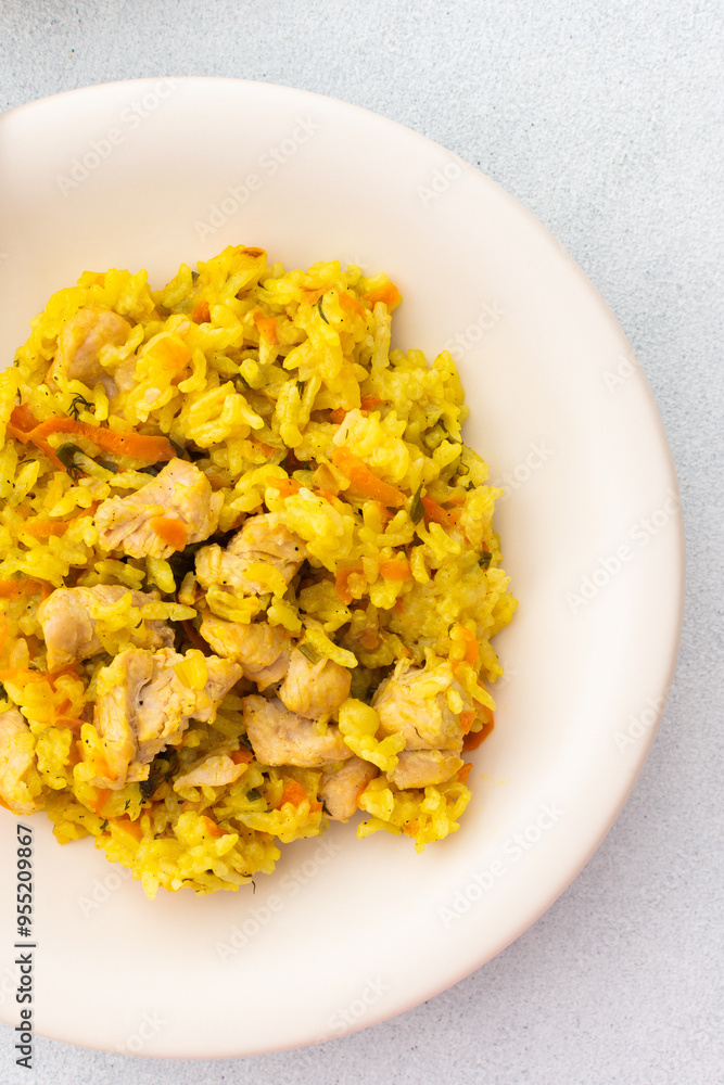 Stewed rice with chicken breast and mixed salad with radishes and various seeds, a delicious hearty lunch or dinner Stewed rice with chicken breast and mixed salad with radishes and various seeds, a delicious hearty lunch or dinner