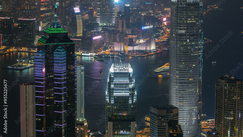 Hong Kong city skyline aerial timelapse at night with Victoria Harbor and skyscrapers Hong Kong city skyline aerial timelapse at night with Victoria Harbor and skyscrapers