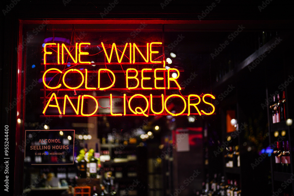 LED lighting of the Wine and liquors store that glowing in red light. Sign and symbole for drink shop. Close-up and selective focus. LED lighting of the Wine and liquors store that glowing in red light. Sign and symbole for drink shop. Close-up and selective focus.