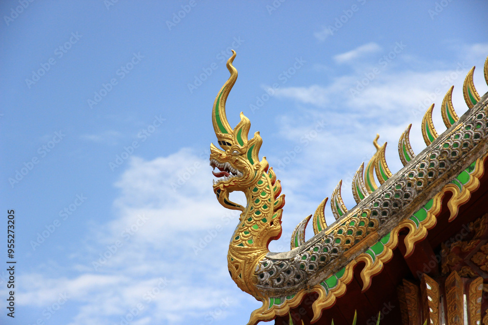Fototapeta premium Naga statue, part of a temple roof in Thailand.
