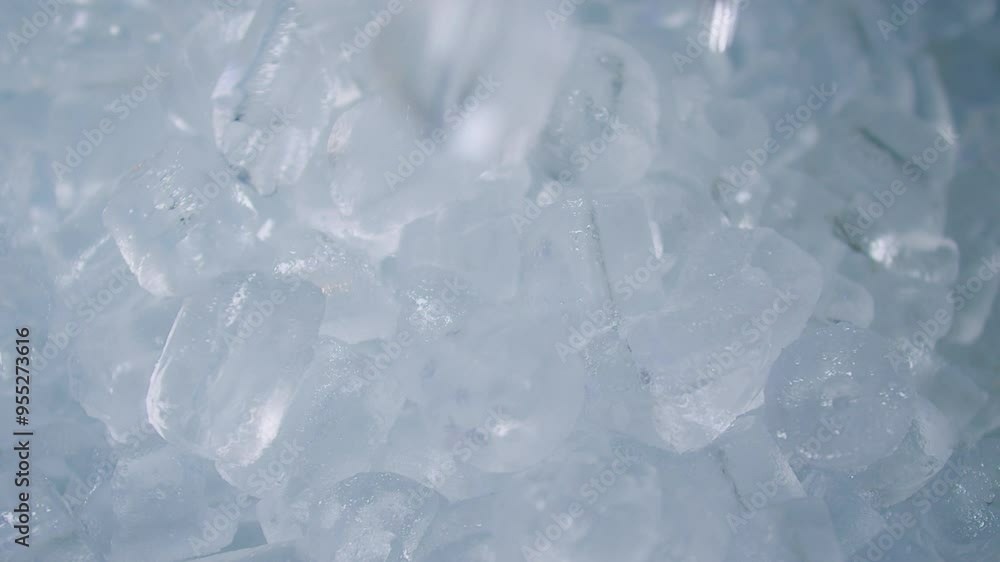 Close-Up of Clear Ice Cubes with a Cool Blue Tint falling down, Perfect for Refreshing Beverages Cocktails and Chilling Drinks, Ideal for Food and Drink Photography Backgrounds and Cooling Concepts Close-Up of Clear Ice Cubes with a Cool Blue Tint falling down, Perfect for Refreshing Beverages Cocktails and Chilling Drinks, Ideal for Food and Drink Photography Backgrounds and Cooling Concepts