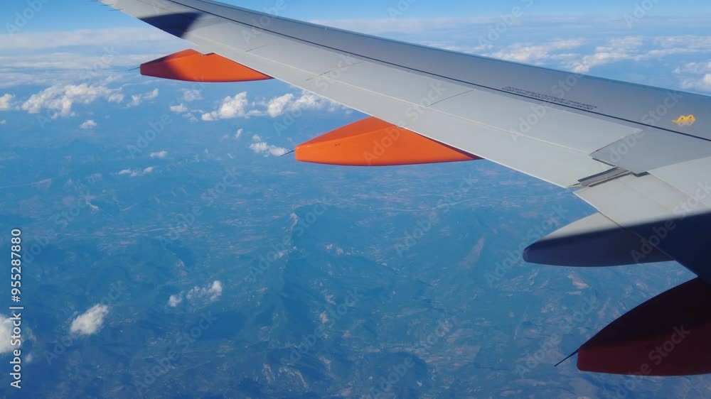 panning shot from unmarked airplane’s wing view flies high above ground, mountain range visible mountain below panning aerial view aviation plane aircraft flight sky flying panning shot from unmarked airplane’s wing view flies high above ground, mountain range visible mountain below panning aerial view aviation plane aircraft flight sky flying