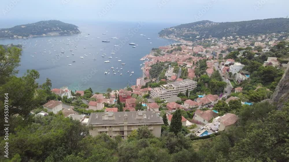 panning shot from high elevation villefranche-sur-mer town’s architecture surrounded by lush green cover built natural landscapes hilltop town architecture panning shot french riviera scenic view panning shot from high elevation villefranche-sur-mer town’s architecture surrounded by lush green cover built natural landscapes hilltop town architecture panning shot french riviera scenic view