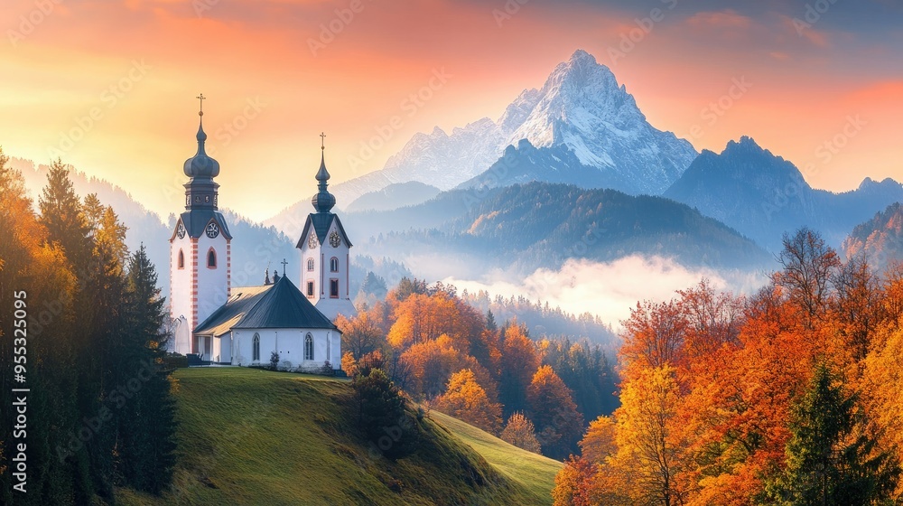 Iconic view of Maria Gern Church with the Hochkalter Peak in the background, autumn colors illuminating the Bavarian landscape at sunrise Iconic view of Maria Gern Church with the Hochkalter Peak in the background, autumn colors illuminating the Bavarian landscape at sunrise
