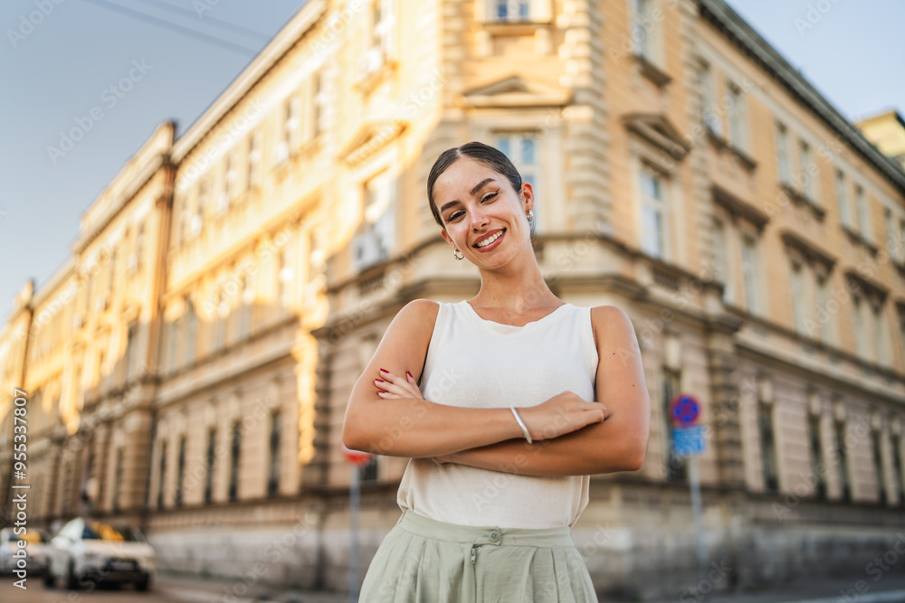 Portrait of beautiful happy young woman stand on the street Portrait of beautiful happy young woman stand on the street