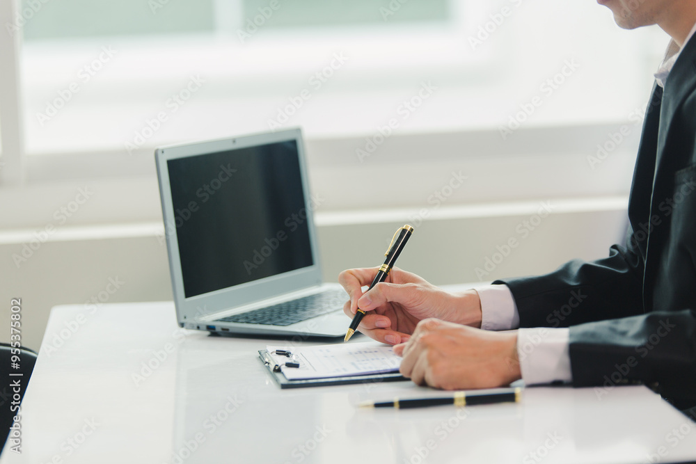 Businessman, house and condo sales agent, handing over keys to clients and signing sales or rental agreements at the office. Real estate business concept. Businessman, house and condo sales agent, handing over keys to clients and signing sales or rental agreements at the office. Real estate business concept.