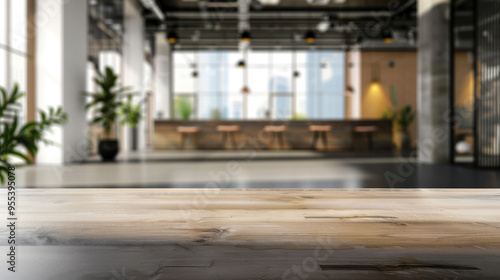 Modern open-plan office with wooden desk, natural light, and airy ambiance perfect for business, productivity, or commercial use, space for product display.