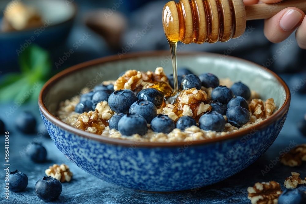 A nutritious bowl of oatmeal topped with fresh blueberries, crunchy walnuts, and drizzled with honey, representing a healthy and delicious breakfast option. A nutritious bowl of oatmeal topped with fresh blueberries, crunchy walnuts, and drizzled with honey, representing a healthy and delicious breakfast option.