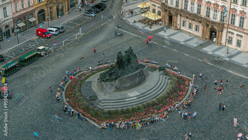 Aerial view of Old Town Square and Jan Hus monument timelapse. People sitting and walking around in Prague, Czech Republic photo