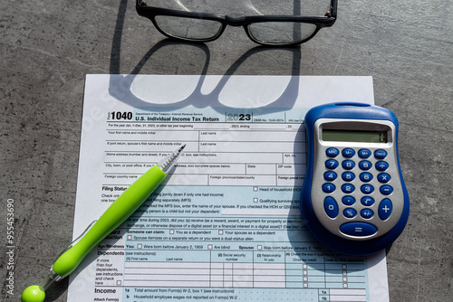  Time to pay taxes concept 1040 tax form pem glasses calculator photo