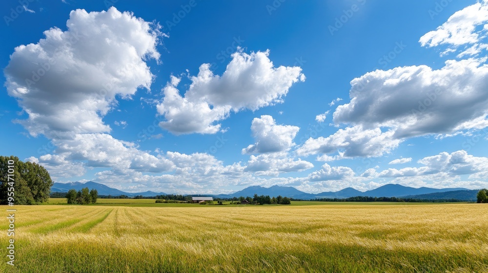Rural landscape panorama with a farm, fields, and distant mountains Rural landscape panorama with a farm, fields, and distant mountains