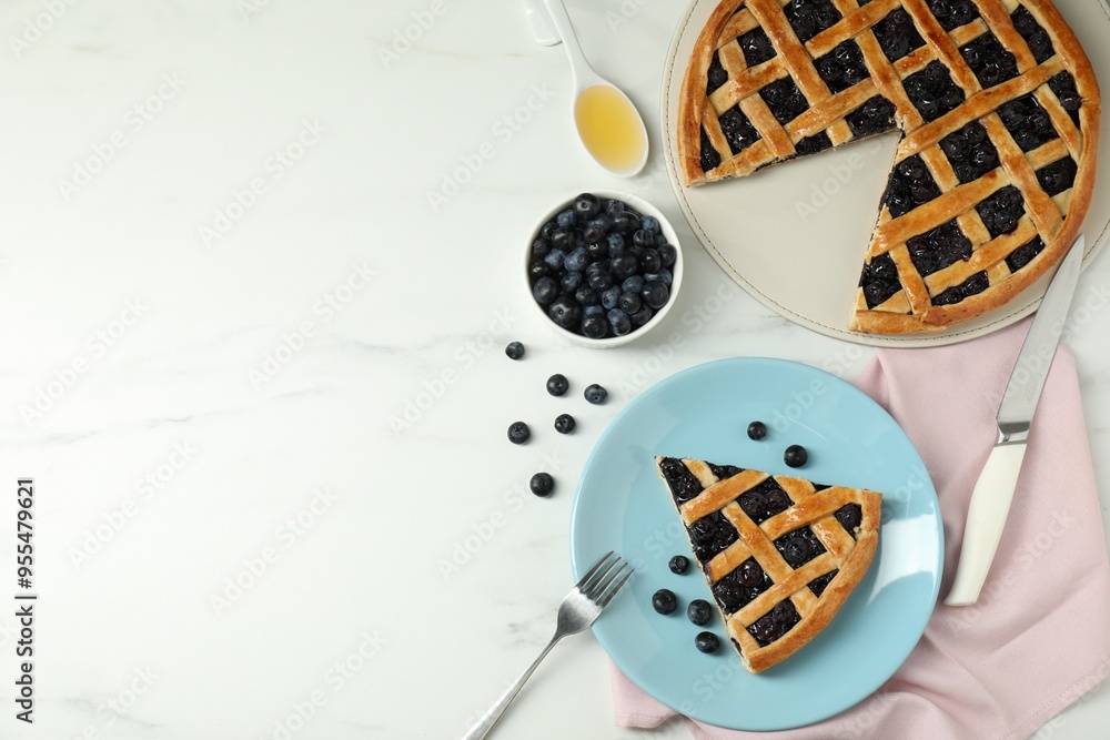 Tasty homemade pie with blueberries served on white marble table, flat lay. Space for text Tasty homemade pie with blueberries served on white marble table, flat lay. Space for text