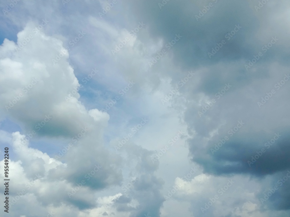 A clear blue sky with a few clouds. The sky is so clear that it almost looks like a painting A clear blue sky with a few clouds. The sky is so clear that it almost looks like a painting