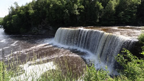 Stunning shot of waterfall in  tahquamenon falls Michigan photo