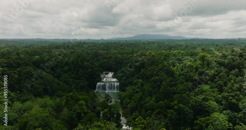 Waterfall in the middle of the forest. Beautiful four-level Tinuy-an Falls. Mindanao, Philippines. photo