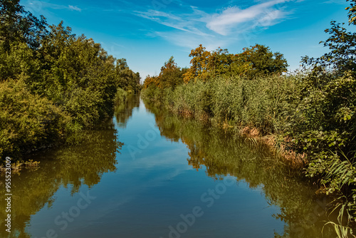 Summer view with reflections at Infohaus Isarmuendung, Moos, Deggendorf, Bavaria, Germany