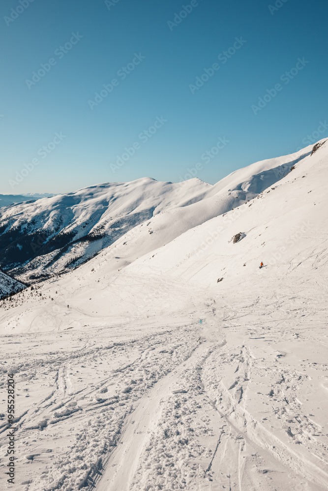 Alpine mountains landscape with white snow and blue sky. Frosty trees under warm sunlight. Wonderful wintry landscape High Tatras, slovakia Alpine mountains landscape with white snow and blue sky. Frosty trees under warm sunlight. Wonderful wintry landscape High Tatras, slovakia