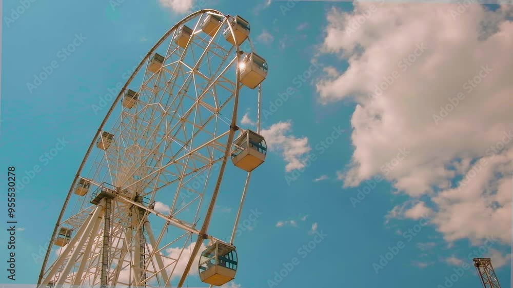 Ferris wheel on a blue sky background. Ferris wheel on a blue sky background.