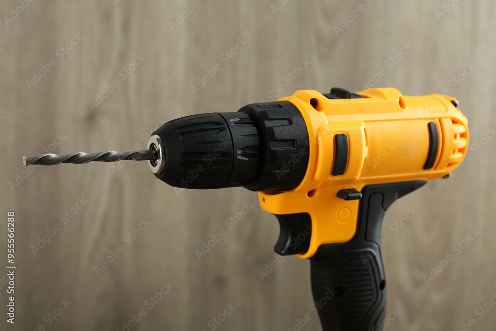 One cordless electric drill against blurred background One cordless electric drill against blurred background