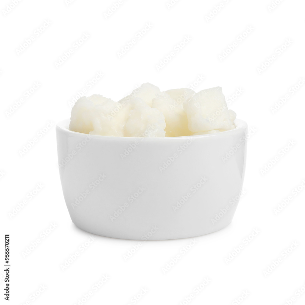 Shea butter in bowl isolated on white Shea butter in bowl isolated on white