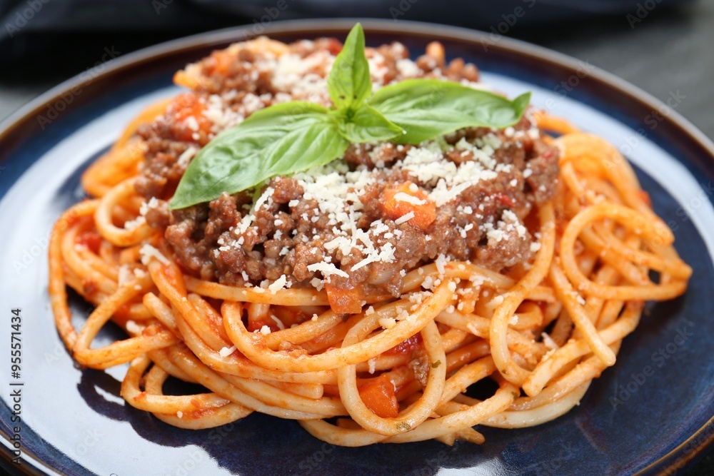 Delicious pasta bolognese with basil on table, closeup Delicious pasta bolognese with basil on table, closeup
