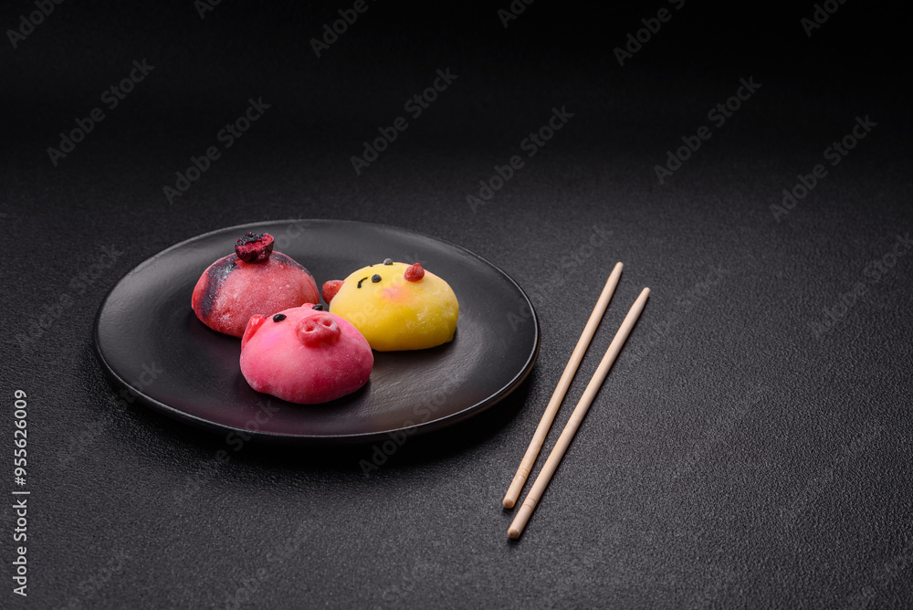 Delicious cold Japanese mochi dessert with colorful rice dough shell and fruit filling Delicious cold Japanese mochi dessert with colorful rice dough shell and fruit filling