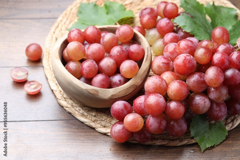 Fresh ripe grapes on wooden table, closeup Fresh ripe grapes on wooden table, closeup