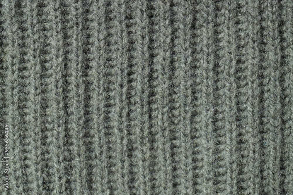 Texture of grey knitted fabric as background, top view Texture of grey knitted fabric as background, top view