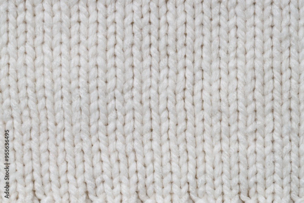 Texture of white knitted fabric as background, top view Texture of white knitted fabric as background, top view