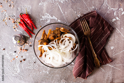 Marinated mushrooms in a glass bowl photo